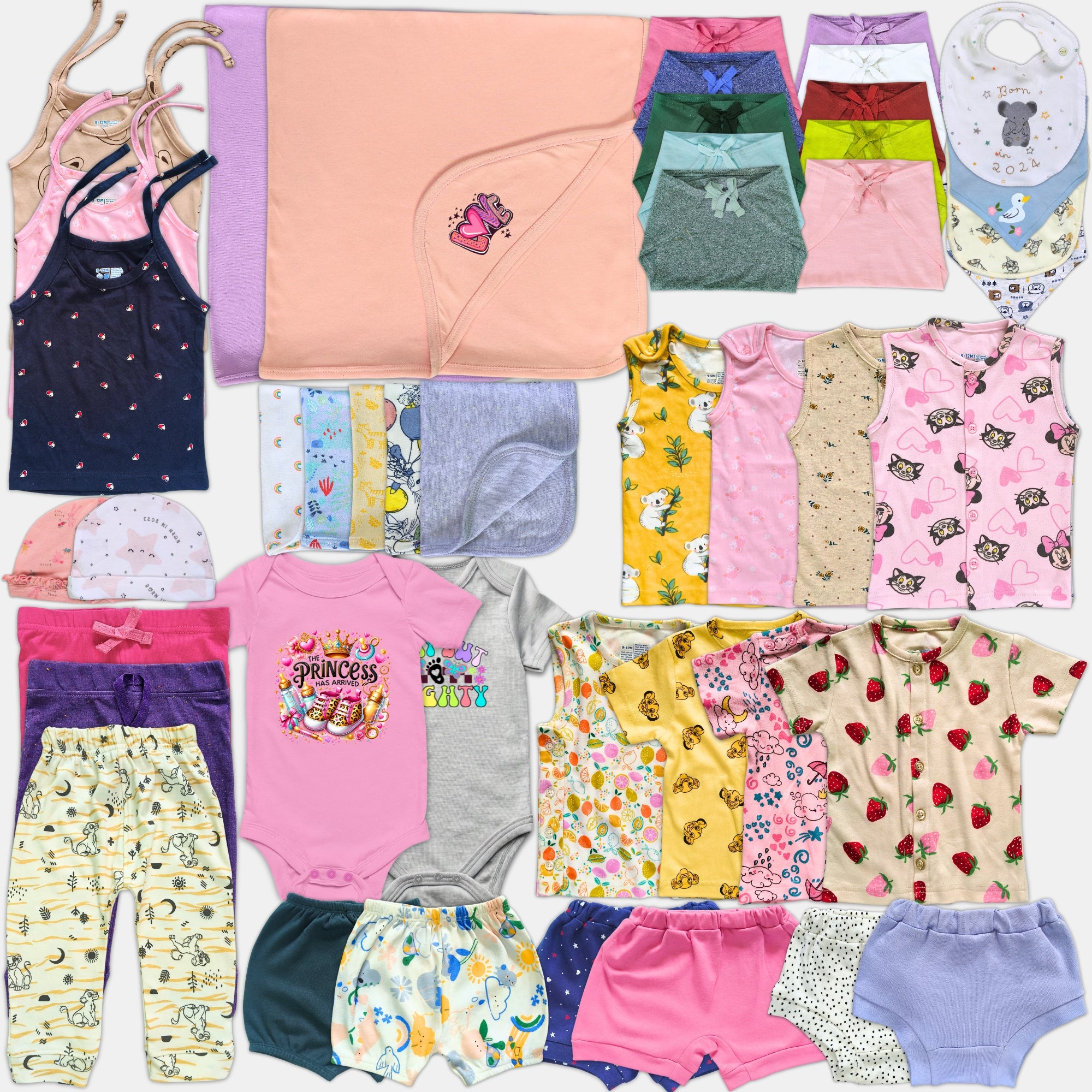 Collection of various children's clothing items including shirts, pants, and onesies.